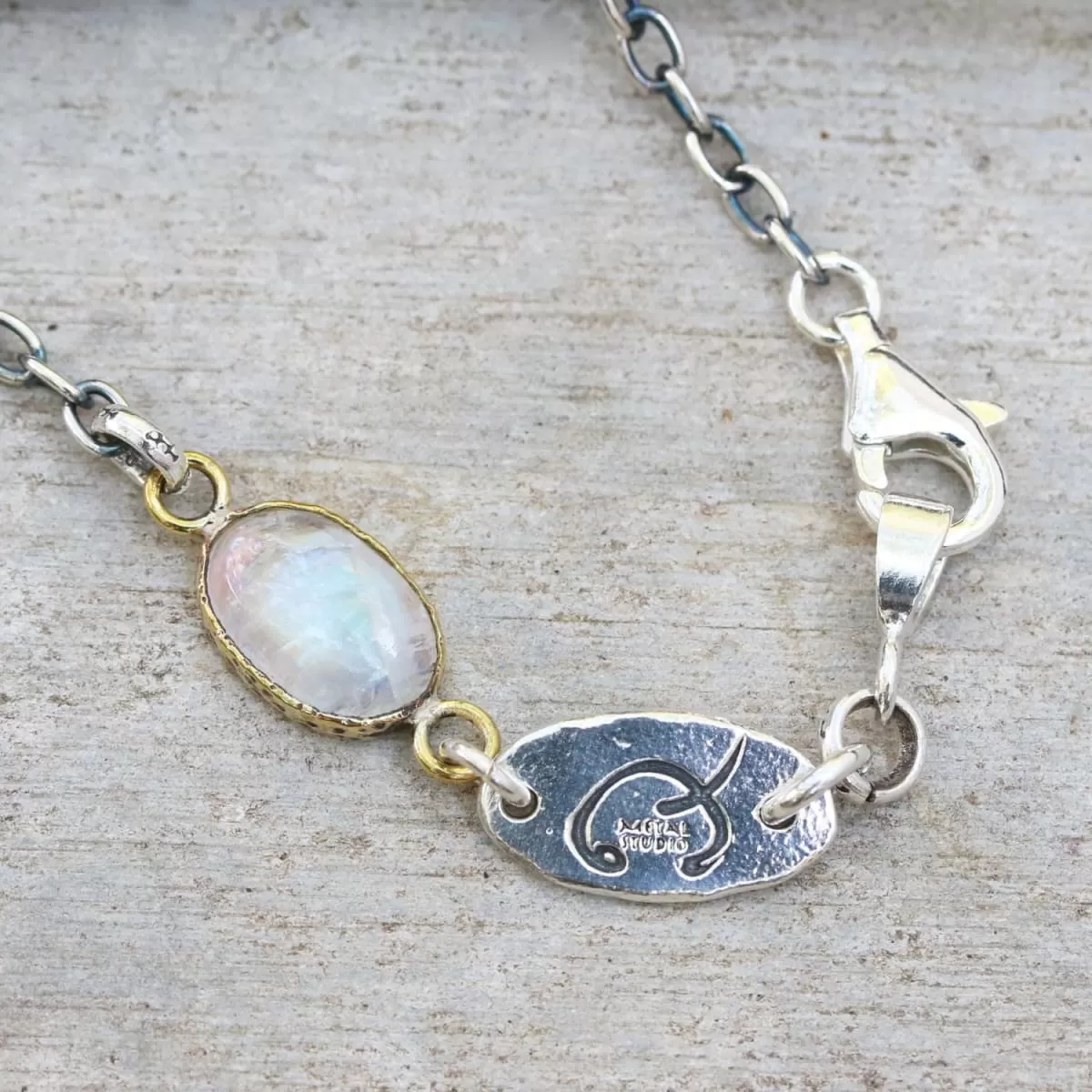 Bracelet oval cabochon moonstone in brass bezel setting and oxidized sterling silver chain